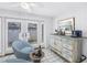 Bright sitting room featuring white walls, french doors, and a coastal-themed decor at 555 21St Ne Ave, St Petersburg, FL 33704