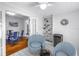 Bright sitting room leads to dining room and features coastal-themed decor and a mini bar at 555 21St Ne Ave, St Petersburg, FL 33704