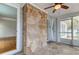 Unique sun room featuring stone flooring, neutral tones and multiple access points to the backyard at 555 21St Ne Ave, St Petersburg, FL 33704