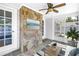 Cozy sun room with stone flooring, a beach mural, and lots of light at 555 21St Ne Ave, St Petersburg, FL 33704