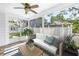 Relaxing sun room featuring a ceiling fan, neutral tones and stone flooring at 555 21St Ne Ave, St Petersburg, FL 33704