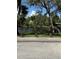 Scenic view of the tranquil river bordered by lush greenery and mature trees at 5608 N River Shore Dr, Tampa, FL 33603