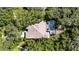 Birds eye view of a home's roof and screened-in pool surrounded by mature landscaping at 5804 Terncrest Dr, Lithia, FL 33547