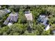 Aerial view of a home and yard featuring a pool, mature trees, and lush landscaping at 5804 Terncrest Dr, Lithia, FL 33547