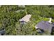 Aerial view showcasing a private backyard featuring a screened pool and mature trees for shade at 5804 Terncrest Dr, Lithia, FL 33547