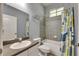 Well-lit bathroom with a combination tub and shower and modern fixtures at 5804 Terncrest Dr, Lithia, FL 33547