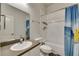 Bathroom with a vanity sink, white cabinets and a tub-shower combo at 5804 Terncrest Dr, Lithia, FL 33547