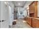 Well-lit bathroom with walk-in shower, soaking tub, and wooden cabinets at 5804 Terncrest Dr, Lithia, FL 33547