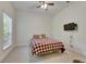 Bright bedroom featuring carpeted floors, window and a ceiling fan at 5804 Terncrest Dr, Lithia, FL 33547