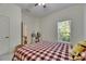 Bedroom features a makeup desk near the window for natural light at 5804 Terncrest Dr, Lithia, FL 33547