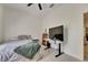 Serene bedroom featuring a large screen TV and comfortable bed at 5804 Terncrest Dr, Lithia, FL 33547