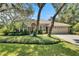 Beautiful single-story home with lush landscaping, mature trees, and a well-maintained lawn at 5804 Terncrest Dr, Lithia, FL 33547