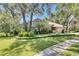 Well-maintained home features manicured lawn, mature landscaping, and beautiful curb appeal at 5804 Terncrest Dr, Lithia, FL 33547