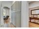 Hallway with large storage cabinets, console table and decorative mirror at 5804 Terncrest Dr, Lithia, FL 33547