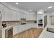 Elegant kitchen with stainless steel appliances, custom cabinets, and wine refrigerator at 5804 Terncrest Dr, Lithia, FL 33547