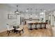 Open kitchen layout with large island, breakfast bar, and dining area for Gathering enjoyment at 5804 Terncrest Dr, Lithia, FL 33547