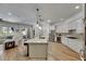 Modern kitchen featuring stainless steel appliances, sleek cabinets, and a large island at 5804 Terncrest Dr, Lithia, FL 33547