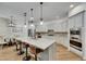 Stylish kitchen with quartz countertops, stainless steel appliances, and modern pendant lighting at 5804 Terncrest Dr, Lithia, FL 33547