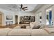 Relaxing living room featuring a large sectional sofa and entertainment center at 5804 Terncrest Dr, Lithia, FL 33547
