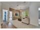 Comfortable living room with a hardwood wall and an open-concept design at 5804 Terncrest Dr, Lithia, FL 33547