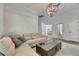 Inviting living room with neutral tones, a cozy couch, and stylish lighting at 5804 Terncrest Dr, Lithia, FL 33547