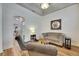 Comfortable living room with stylish furniture, tray ceiling, and wood flooring throughout at 5804 Terncrest Dr, Lithia, FL 33547