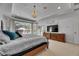 Large bedroom with bay window, tray ceiling, chandelier, and carpet flooring at 5804 Terncrest Dr, Lithia, FL 33547