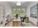 Office space features arched windows, wood flooring, and stylish decor for a productive workspace at 5804 Terncrest Dr, Lithia, FL 33547