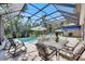 Inviting screened pool area with outdoor seating and well-maintained landscaping at 5804 Terncrest Dr, Lithia, FL 33547