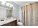 Full bathroom with vanity, and bathtub shower combination with a patterned shower curtain at 5908 Mohr Rd, Tampa, FL 33615