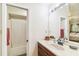 Bathroom with a spacious vanity, large mirror, shower and lots of light at 5908 Mohr Rd, Tampa, FL 33615