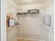 A walk-in closet features built-in wire shelving, and storage solutions for effective organization at 5908 Mohr Rd, Tampa, FL 33615