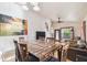 Open-concept dining room connects to the living room with wood floors and plenty of seating at 5908 Mohr Rd, Tampa, FL 33615