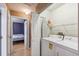 Laundry room with washer, dryer, ironing board and shelving for easy access and convenience at 5908 Mohr Rd, Tampa, FL 33615
