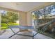 Covered patio featuring a hammock and view of the green back yard at 5908 Mohr Rd, Tampa, FL 33615