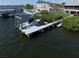 Waterfront home boasts a private boat dock with a lift for easy access to open water at 6663 Bayou Grande Ne Blvd, St Petersburg, FL 33702