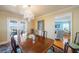 Formal dining room with a chandelier, table that seats eight, and doors leading to a balcony at 6663 Bayou Grande Ne Blvd, St Petersburg, FL 33702