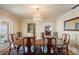 Formal dining room with a chandelier, table that seats eight, and doors leading to a balcony at 6663 Bayou Grande Ne Blvd, St Petersburg, FL 33702
