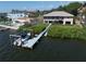 Waterfront home features a dock with a boat lift and easy access to the bay at 6663 Bayou Grande Ne Blvd, St Petersburg, FL 33702