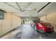 Attached garage featuring a red car parked inside, providing secure parking and storage space at 6663 Bayou Grande Ne Blvd, St Petersburg, FL 33702