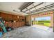Spacious garage with abundant storage, workspace, and a view of the yard and waterfront at 6663 Bayou Grande Ne Blvd, St Petersburg, FL 33702
