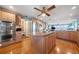 Large kitchen island with stainless appliances and stone countertop, connecting living area at 6663 Bayou Grande Ne Blvd, St Petersburg, FL 33702