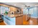 Spacious kitchen features granite countertops, wood cabinets, and a ceiling fan for added comfort at 6663 Bayou Grande Ne Blvd, St Petersburg, FL 33702