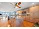 Large kitchen featuring an island, natural wood cabinets, granite countertops, and an open layout at 6663 Bayou Grande Ne Blvd, St Petersburg, FL 33702