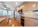 Bright kitchen with stainless steel appliances, granite counters, and light wood cabinets at 6663 Bayou Grande Ne Blvd, St Petersburg, FL 33702