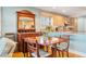 Charming kitchen/dining area features antique mirror, cabinets and a beautiful view into the cooking space at 6663 Bayou Grande Ne Blvd, St Petersburg, FL 33702