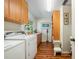 Bright laundry room with ample storage, countertop space, and modern appliances at 6663 Bayou Grande Ne Blvd, St Petersburg, FL 33702