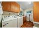 Practical laundry room with ample storage, countertop space, and essential appliances at 6663 Bayou Grande Ne Blvd, St Petersburg, FL 33702
