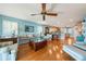 Open concept living area, hardwood floors, cozy couch and eat-in kitchen at 6663 Bayou Grande Ne Blvd, St Petersburg, FL 33702