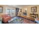 Bright living room featuring a comfortable sofa, armchairs, and a glass coffee table on top of an area rug at 6663 Bayou Grande Ne Blvd, St Petersburg, FL 33702